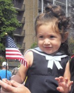 Alvigha Doupe waves her American Flag during Monday’s ceremonies in Veterans’ Memorial Park in Oswego.