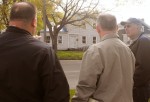 ward walk three Second Ward Councilor Mike Myers, left, points out a property in his ward Wednesday. Looking on are First Ward Councilor Fran Enwright, right, and Neal Smith, code enforcement.