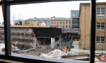 The view from the second floor of the rising Science and Engineering Innovation Corridor shows work progressing on the soon-to-be-adjoining Wilber Hall addition for the School of Education. The tunnel-like opening at center will be one terminus of a covered walkway from the Piez Hall addition to Wilber. At left and right, respectively, construction continues on a new manufacturing laboratory for technology education and the school's field placement office.