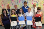 Minetto Elementary School recently conducted its sixth grade honors program. Involved in the event were (in front) Gina Bartholomew. Danielle DelConte, Alaina McMahon, Payton Reese and Lauren Jones, while in back are Principal Dr. Dean Goewey, Board of Education member Thomas DeCastro, Jacob Getman and former Minetto Principal Robert Stone.