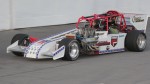 Keith Gilliam takes a passenger around Oswego Speedway in the 2-Seat Supermodified (Mike Johnson Photo)