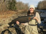 New York City attorney Emily Viglietta holds a beautiful steelhead taken last fall on the upper Salmon River in Oswego County.