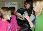 A mini-carnival for families is among many events showcasing student skills and fun during Family and Friends Weekend, Oct. 19 to 21. Here education major Leonie Matzker paints the face of 9-year-old visitor Zoe Babcock during last year's activities.
