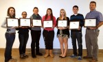 Some of the Empire State School Press Association “Gold” awards are held by Buccaneer Bulletin staff members. From left are: Business Manager Gabrielle Sacco, Sports Editor Alanna Maldonado, Co-Managing Editor Chloe Martin, Editor-in-Chief Madison Rhoades, Co-Managing Editor Taylor Falls, Chief Photographer Patrick Baer and co-advisor Bill Reeser.