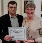 Oswego County Farm Bureau member Eric Behling and Oswego County Farm Bureau President Nancy Weber accept the Silver Key Award at the New York Farm Bureau State annual meeting.