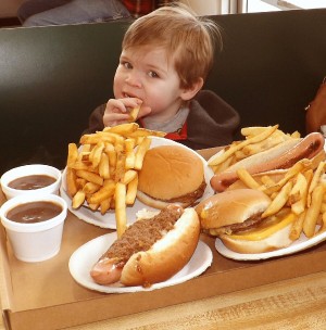 Garrison Earl enjoys his lunch on opening day at Rudy's.